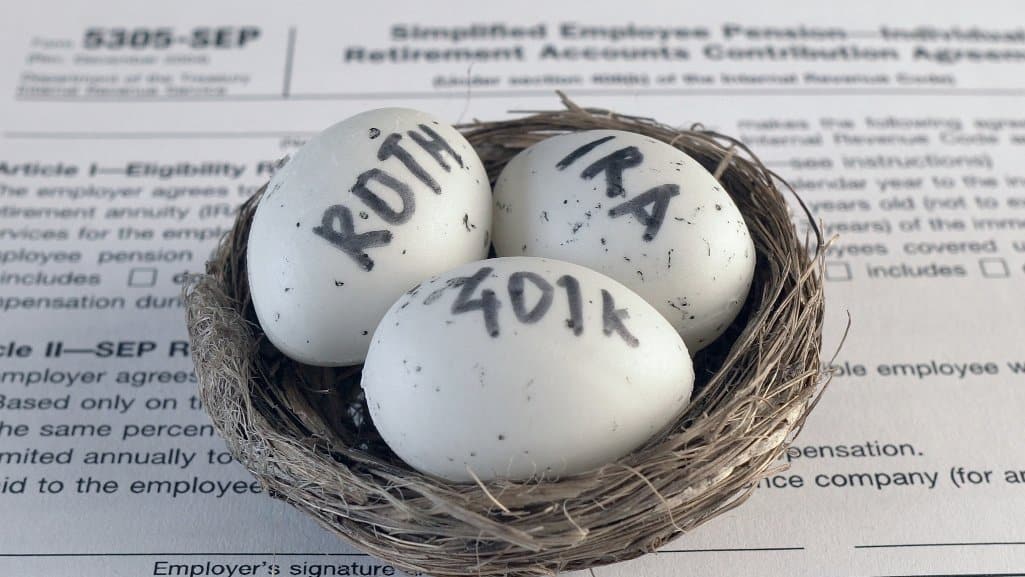 Three eggs laying in birds nest, labeled Roth, IRA, and 401K.