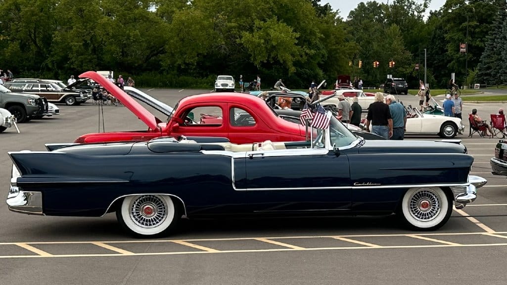 1955 Cadillac Series 62 Eldorado Convertible parked in a lot off of Woodward Avenue at the Woodward Dream Cruise.