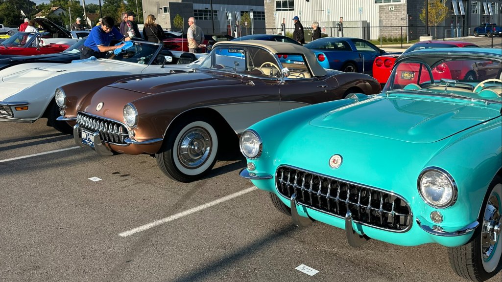 Classic Chevrolet Corvettes lined up in a parking lot off of Woodward Avenue at the Woodward Dream Cruise.
