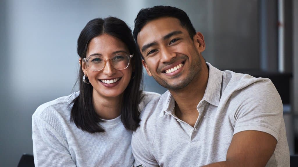 Smiling couple just approved for a personal loan from People Driven Credit Union in Michigan.