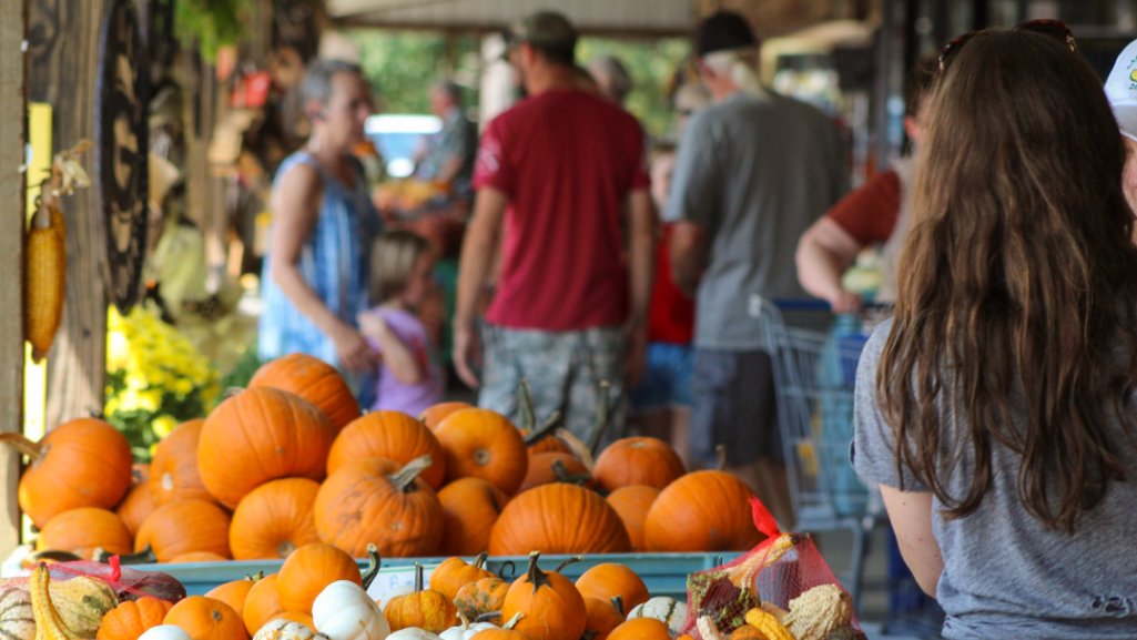 Shoppers at an outdoor Farmers' market in Michigan.