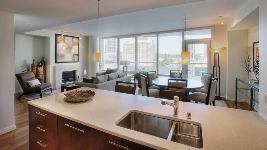 Luxury high-rise apartment with city skyline view through large windows, symbolizing too-good-to-be-true rental listings.