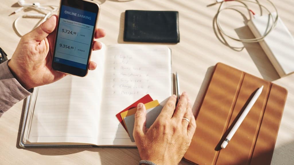 PDCU member using the MyPDCU mobile banking app to review their accounts with People Driven Credit Union.