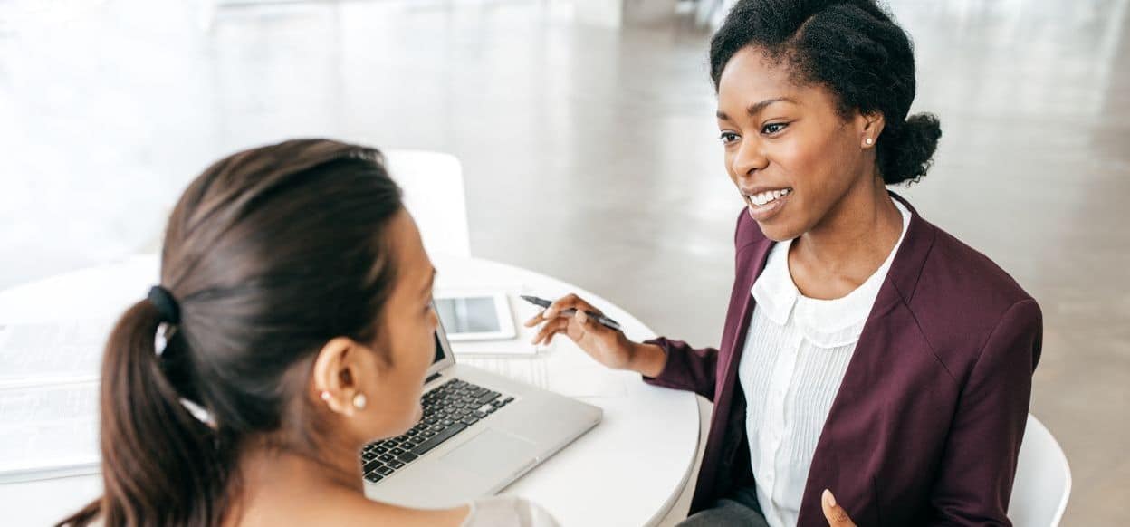 People Driven Credit Union loan officer in Royal Oak talking with a member about a personal loan.