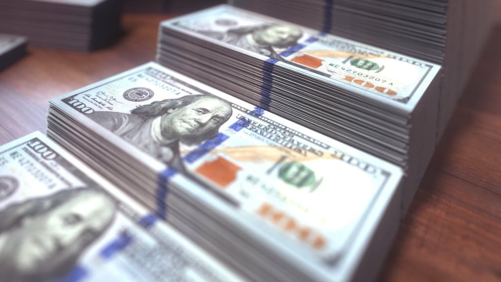 Stacks of money doubling to represent The Rule of 72.