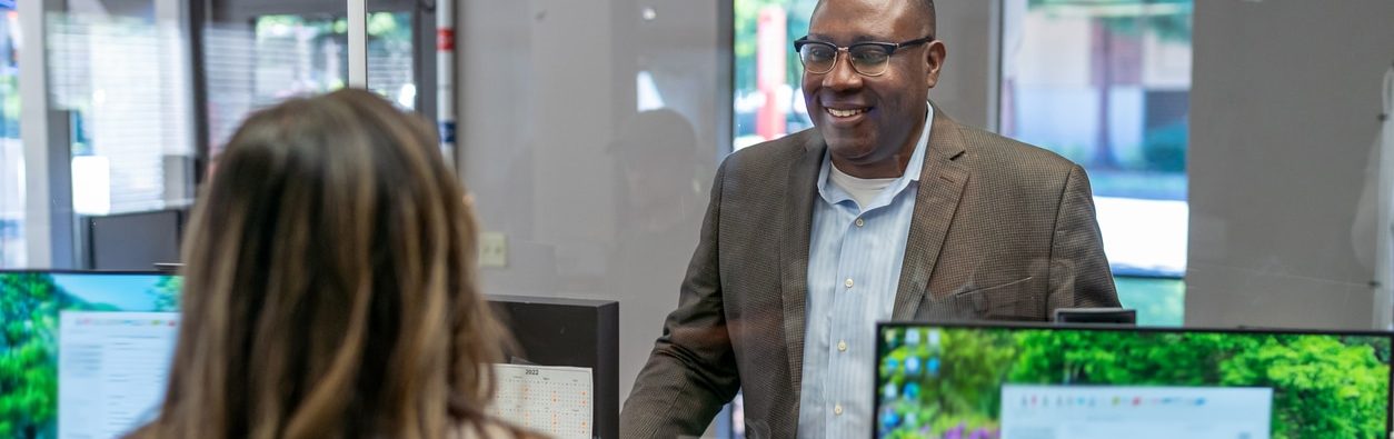 Loan officer reviewing personal loan options with a member at People Driven Credit Union's Warren branch near Madison Heights, Michigan